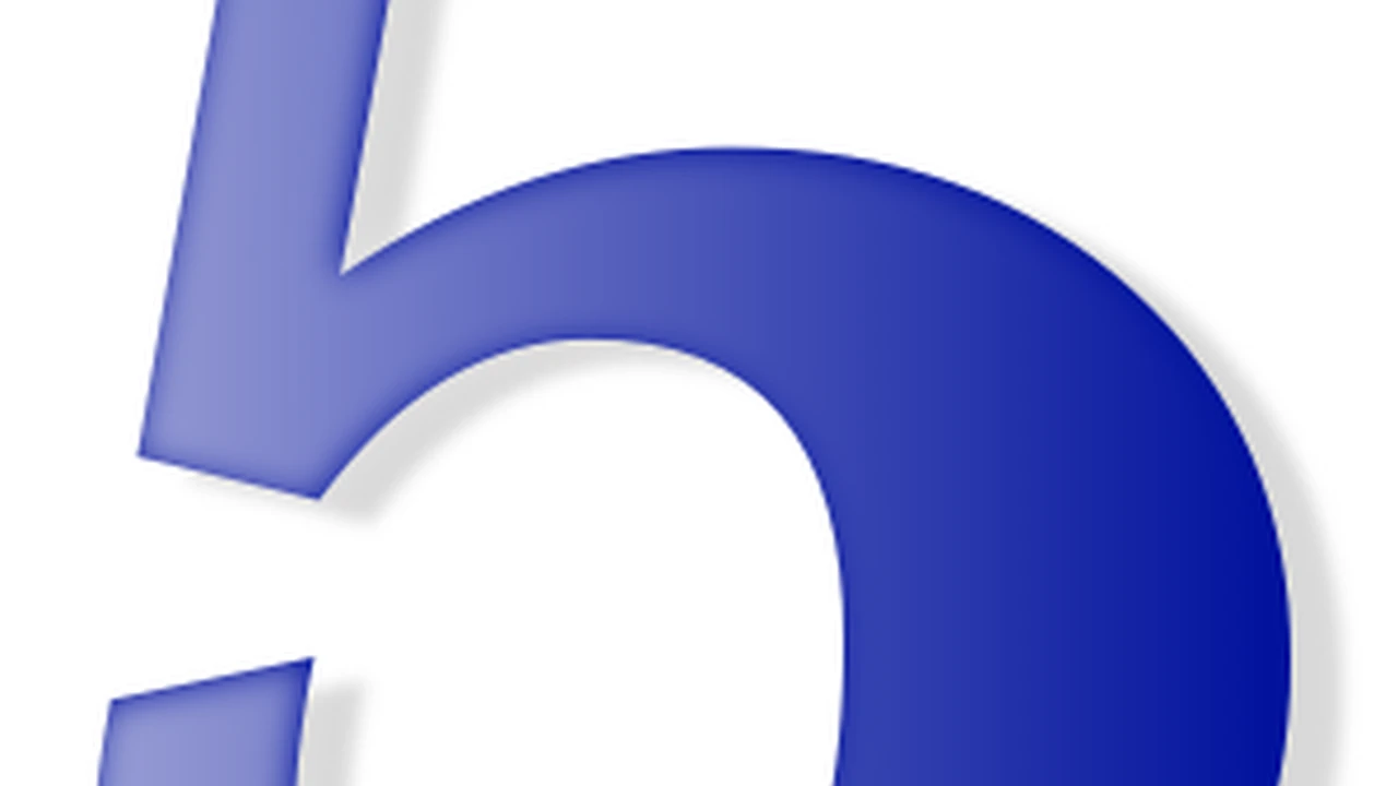 closeup of slices of Pressure Cooker Corned Beef on a platter with potatoes, carrots, and Brussels sprouts