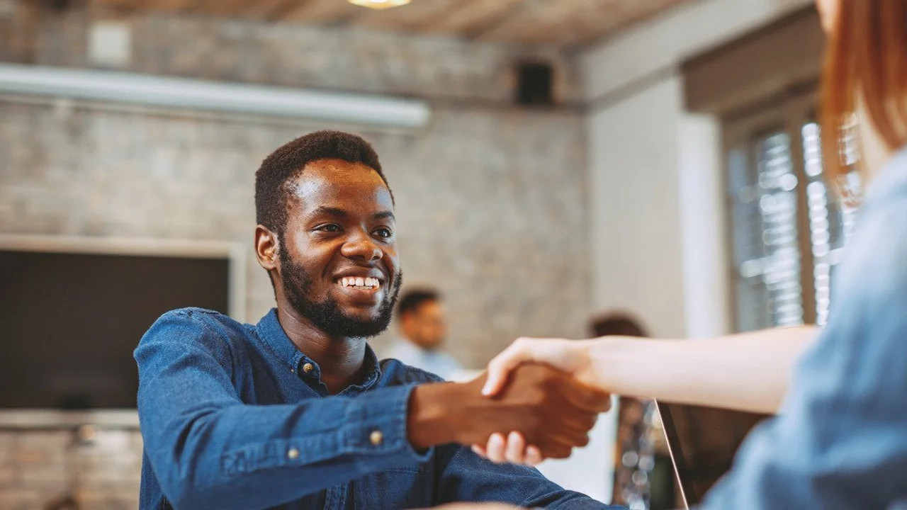 overhead view of corned beef sliced and on a platter with cabbage, potatoes, and carrots