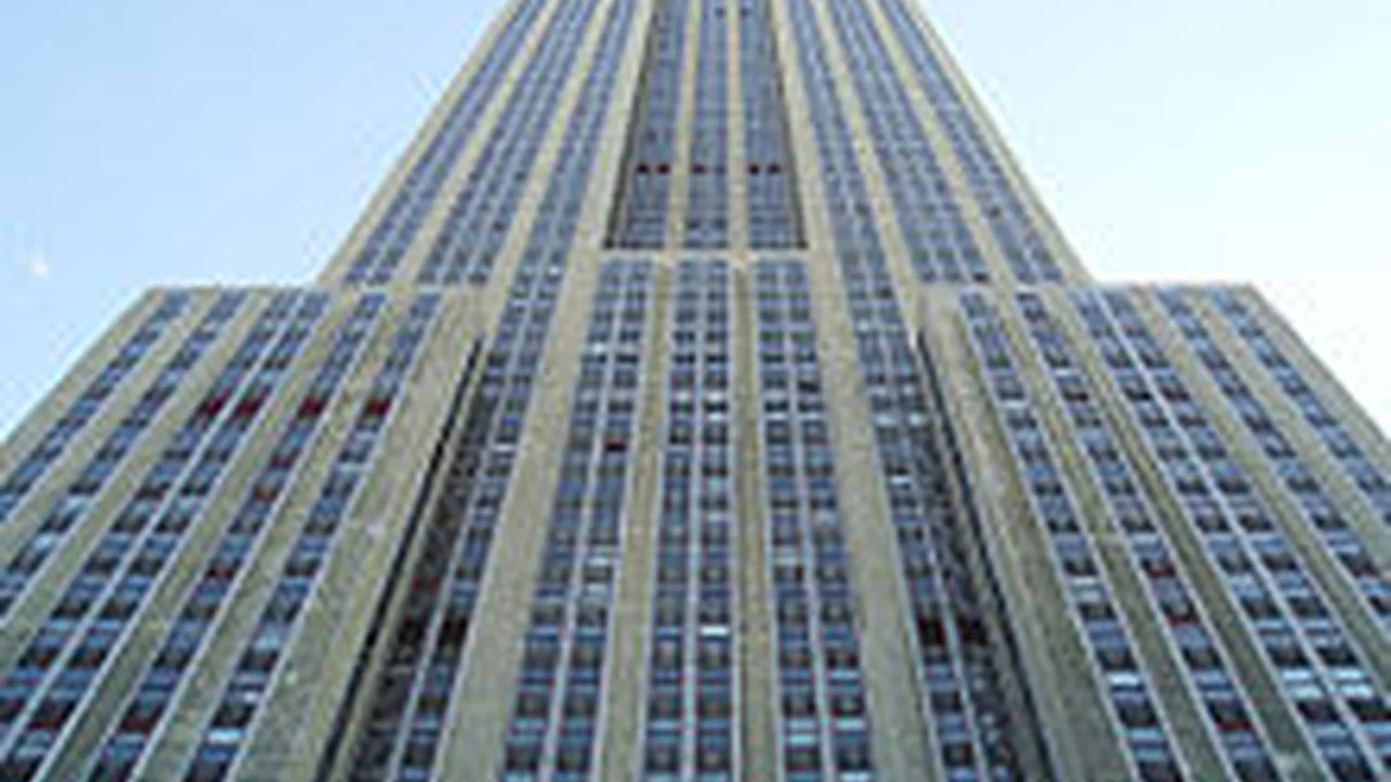 overhead view of corned beef sliced and on a platter with cabbage, potatoes, and carrots