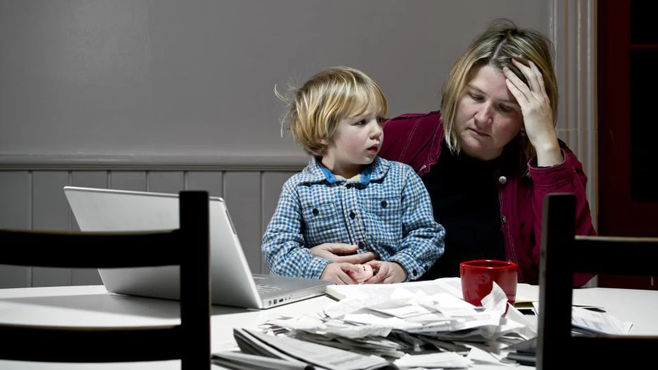 Close up on a plate of mashed potatoes, topped with baked pork chops with cream of mushroom soup, and a side of green beans.