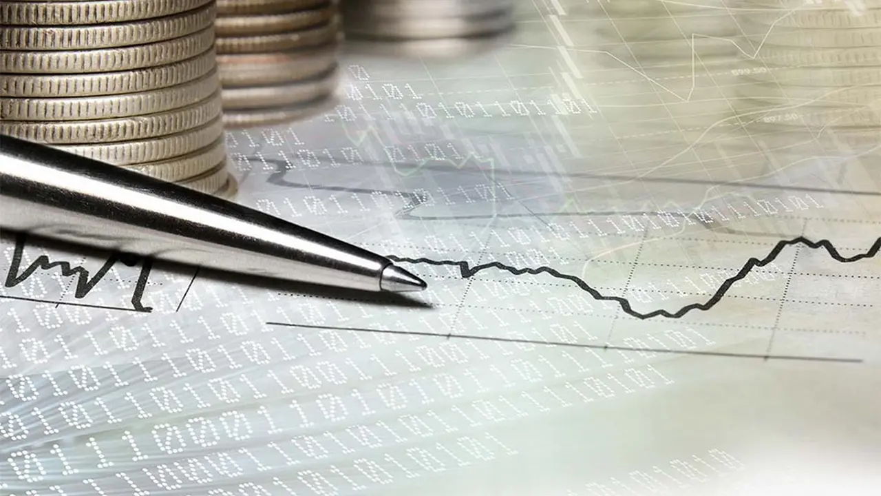 Close up on a plate of mashed potatoes, topped with baked pork chops with cream of mushroom soup, and a side of green beans.