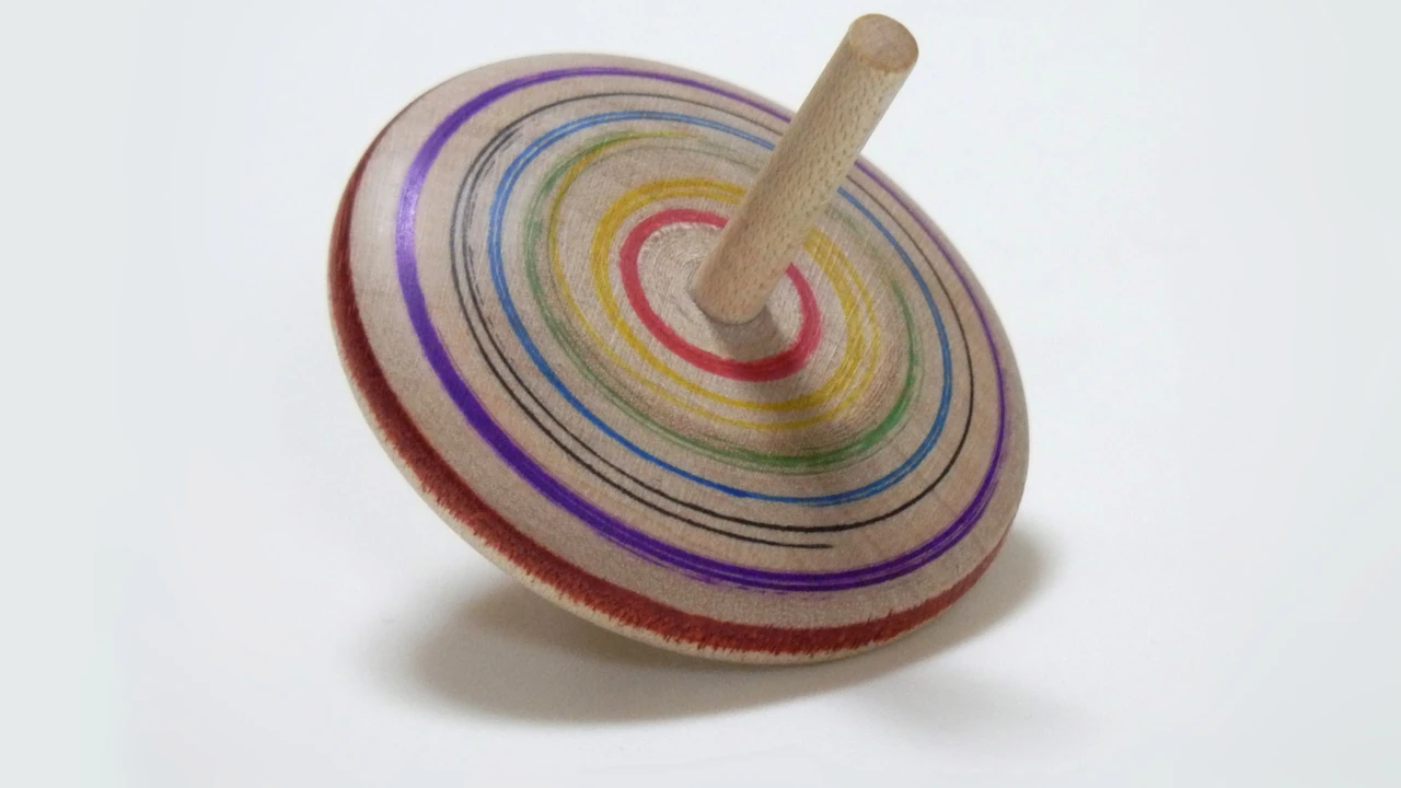 Close up on a plate of mashed potatoes, topped with baked pork chops with cream of mushroom soup, and a side of green beans.