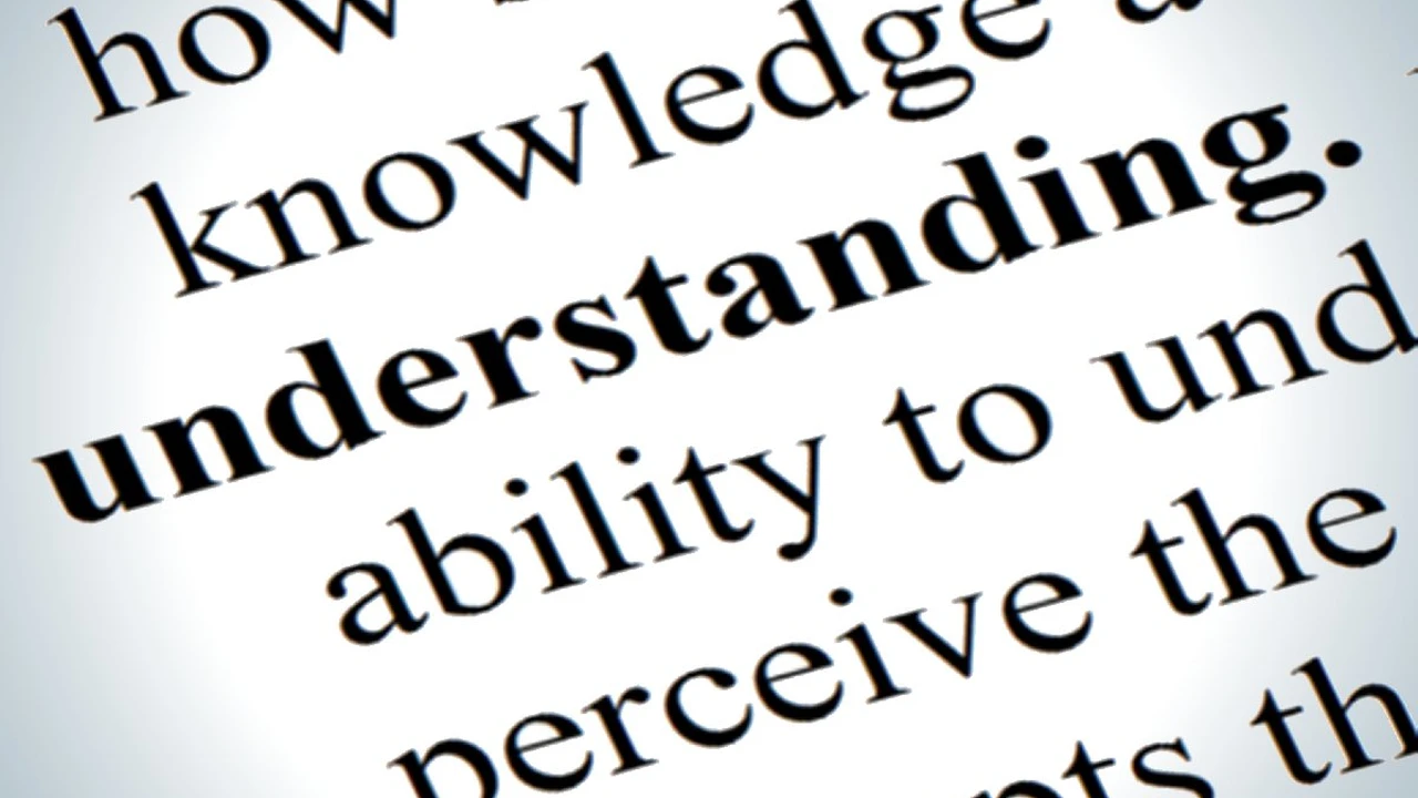 Close up on a plate of mashed potatoes, topped with baked pork chops with cream of mushroom soup, and a side of green beans.